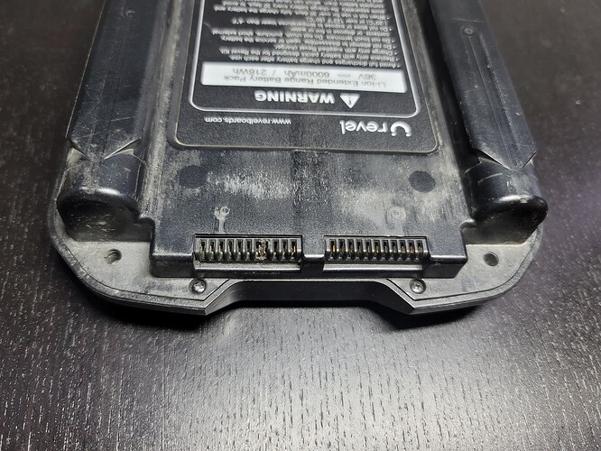 Revel battery contact pins