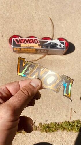 Venom Skate shared a post on Instagram: "Did we mention the new SideShows come with this FLY FRESH 2 DETH foil gold Venom sticker? #venomskate #sideshows". Follow their account to see 1605 posts.